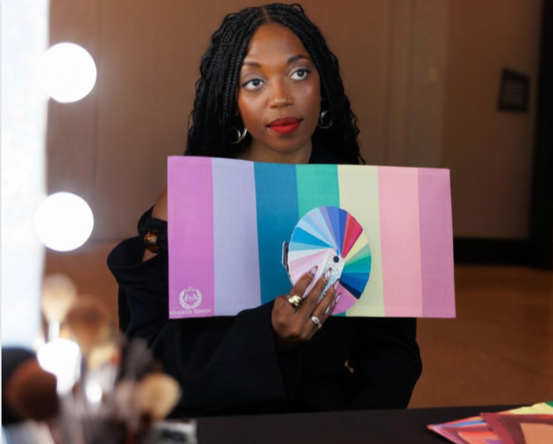 Danika James-Brayboy holding a color analysis palette, representing identity-led styling and reflection